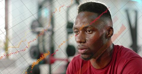 Focused male athlete training with weights, layering rising data chart overlays