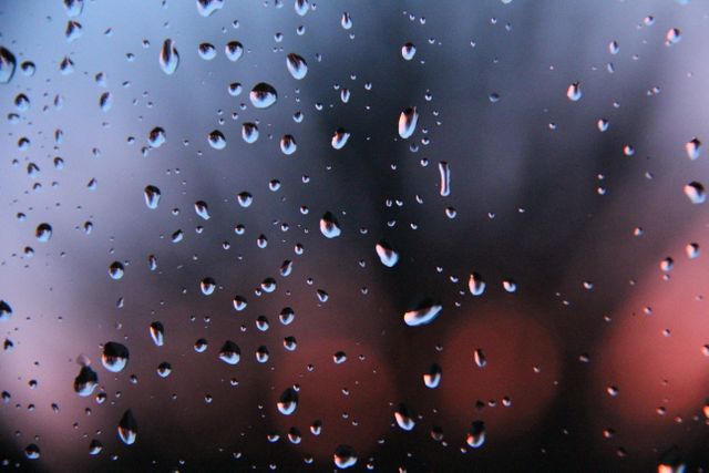 Closeup of Raindrops on Window with Blurred Sunset Background - Download Free Stock Photos Pikwizard.com