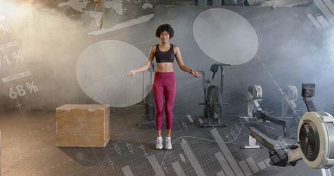 African American Woman Jump Roping in Futuristic Gym with Data Overlay