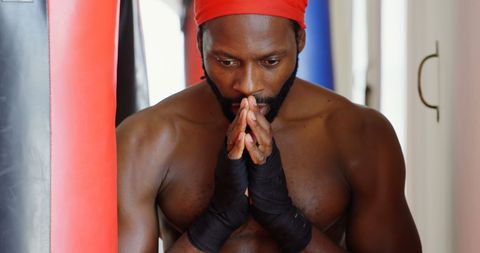 Determined Boxer Preparing in Gym