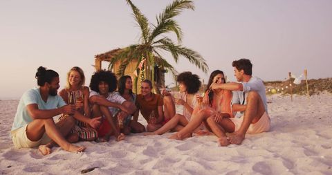 Diverse Friends Enjoying Sunset on Beach