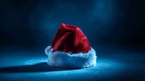 Red Velvet Santa Hat Resting on Moody Spotlighted Floor, Glittering White Fur Trim