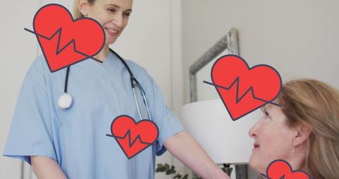 Smiling female doctor attending her patient in hospital room