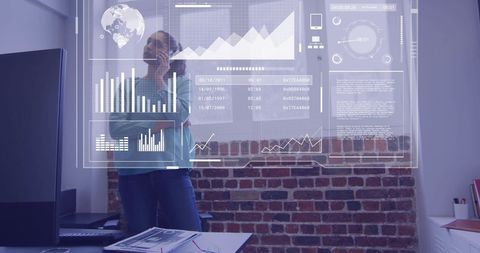 Woman Analyzing Holographic Financial Data in Modern Office