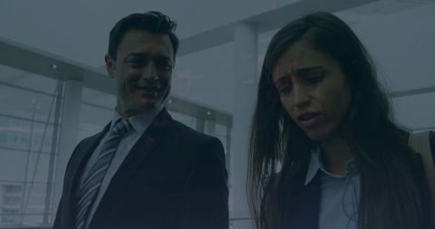 Business professionals engaging in discussion at modern airport