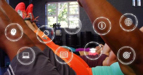 Group performing core leg raises on mats with orange leggings and fitness hud overlays