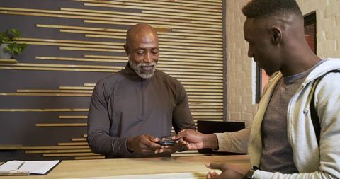 Modern Transaction at Cafe Counter with Friendly Staff