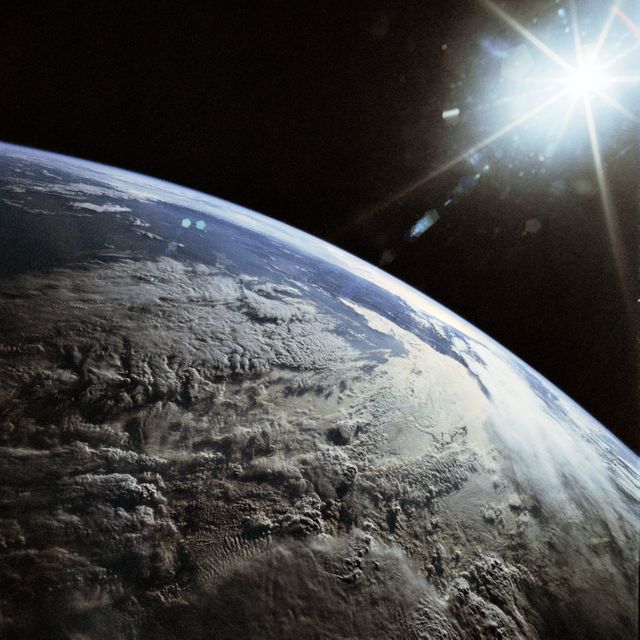 View shows the Earth from space with a focus on the Andes Mountains under late afternoon sun. Captured during Space Shuttle Discovery mission in 1990. Ideal for educational materials, astronomy studies, and space exploration presentations.
