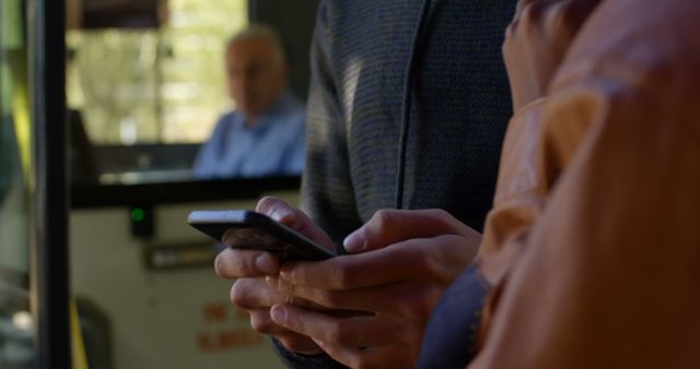 Close-up of Person Using Smartphone on Public Bus - Download Free Stock Images Pikwizard.com