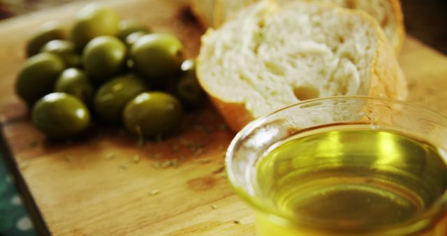 Fresh Green Olives with Sliced Bread and Olive Oil on Wooden Board - Download Free Stock Images Pikwizard.com