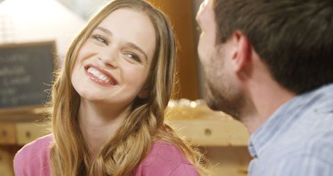 Caucasian Couple Sharing Warm Smiles in Cozy Coffee Shop - Download Free Stock Images Pikwizard.com