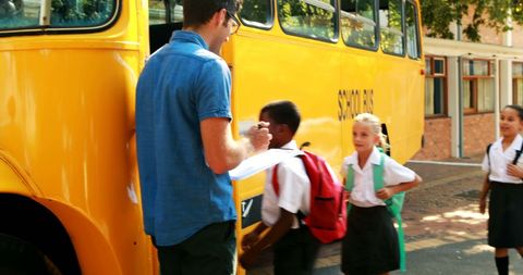 Teacher Verifying Attendance for Students Boarding School Bus - Download Free Stock Images Pikwizard.com