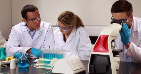 Scientists Experimenting in Advanced Laboratory Setting