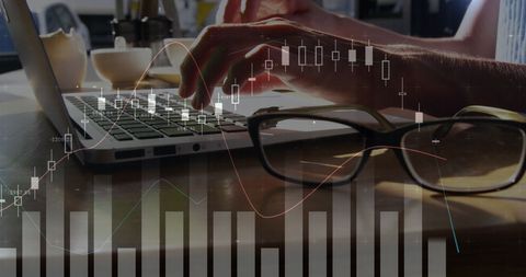 analyzing financial markets on laptop with graph overlay - Download Free Stock Images Pikwizard.com