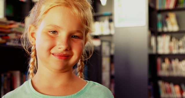 Cheerful Young Girl Smiling in Library with Books in Background - Download Free Stock Images Pikwizard.com