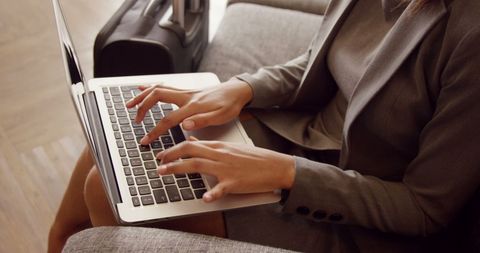 Businesswoman Typing on Laptop in Modern Workspace - Download Free Stock Images Pikwizard.com