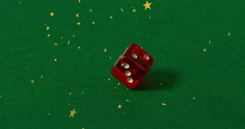 Falling Starry Dice on Green Felt Surface