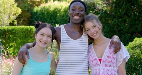 Diverse Friends Enjoying Summer Day in Garden