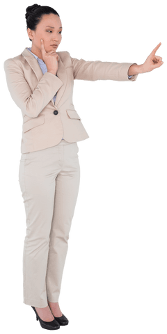 Confident Asian Businesswoman in Beige Suit Pointing on Transparent Background