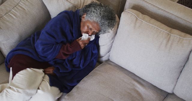 Elderly Woman Resting on Sofa Feeling Unwell and Wrapped in Blanket - Download Free Stock Images Pikwizard.com