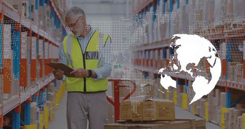 Warehouse supervisor inspecting inventory in distribution center