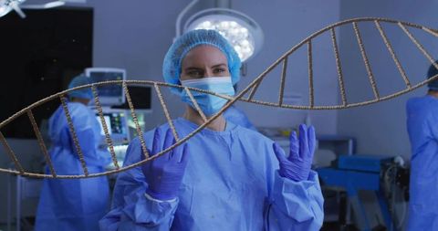 Surgeon manipulating holographic dna helix during precision genomics surgery in or