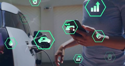 Woman Uses Smartphone as Electric Vehicle Charges