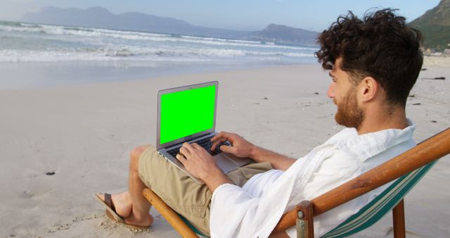 Man Working on Laptop at Tropical Beach - Download Free Stock Images Pikwizard.com