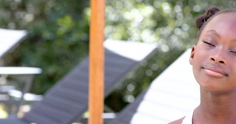 Serene Child Outdoors Relaxing in Sunlight