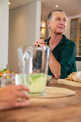 Senior Friends Enjoying Healthy Meal Together at Home