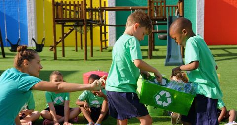 Teacher Guiding Children in Recycling Activity Outdoors - Download Free Stock Images Pikwizard.com