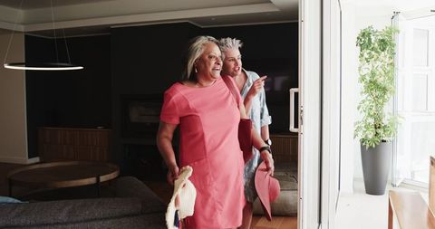 Senior Lesbian Couple Embracing Enjoying Vacation Hotel