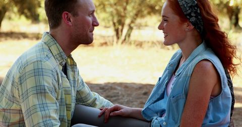Couple Enjoying Outdoor Conversation Amidst Nature - Download Free Stock Images Pikwizard.com