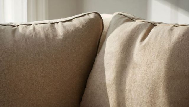 Beige Linen Sofa Cushions with Piped Seams and Sunlit Texture for Cozy Modern Interiors