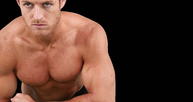 Portrait of focused caucasian strong man flexing muscles with copy space on black background - Download Free Stock Photos Pikwizard.com