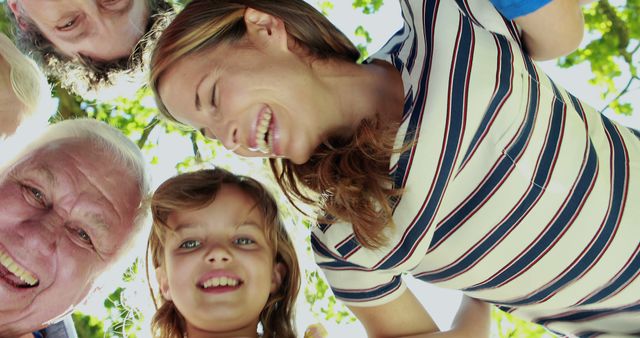 Multigenerational Family Smiling Outdoors on a Sunny Day - Download Free Stock Images Pikwizard.com