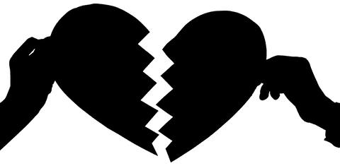 Transparent Silhouette of Hands Holding Broken Heart Halves