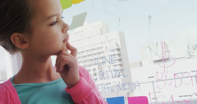 Child Thinking and Writing Strategic Plan on Glass Window - Download Free Stock Images Pikwizard.com