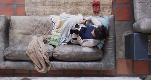 Cozy Home Relaxation with Coffee and Smartphone from Above - Download Free Stock Images Pikwizard.com