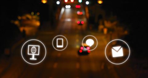 Digital Interface Icons Overlay on Urban Night Skyline