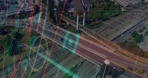 Smart city overpass connecting rail and road networks, neon data overlay, aerial drone