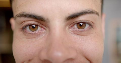 Close-up on brown eyes expressing emotion and intensity