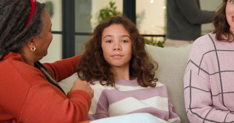 Three generations enjoying quality family time in cozy living room