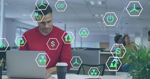 Man in red sweater working on laptop with sustainability and green energy icons overlay