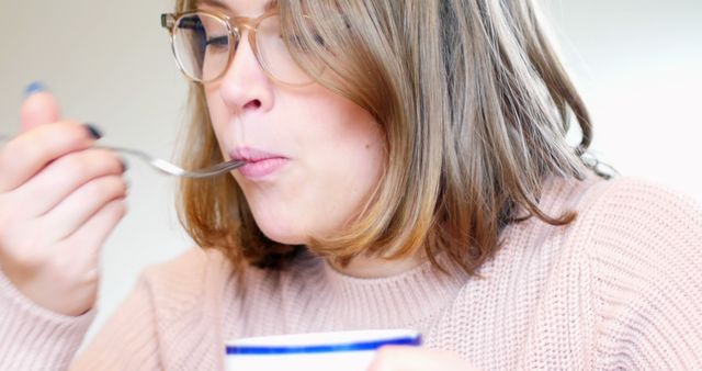 Young Woman Enjoying a Warm Drink Indoors - Download Free Stock Images Pikwizard.com