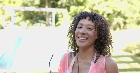 Joyful Woman Enjoying Sunny Day by Home Pool