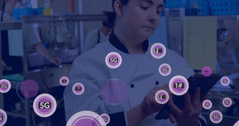 Chef Using Tablet with 5G Technology Overlay in Kitchen