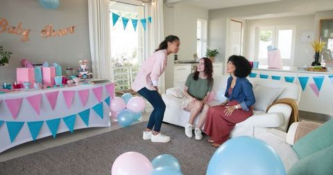 Multiracial Friends Enjoy Baby Shower Celebration at Home