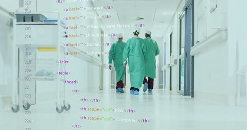 Medical Professionals Walking in Hospital with Digital Code Overlay