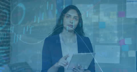 Businesswoman Analyzing Financial Data on Tablet Screen